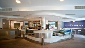 a restaurant with a counter and a bar at Hotel Dei in Cascia +32 photos