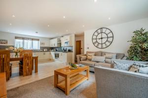a living room with a couch and a table at 2 Bed in St. Issey oc-o27778 in Saint Issey