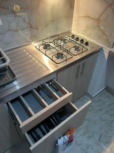 a kitchen with a stove top in a kitchen at KD Prime Suite Al Norte de la Ciudad in Valledupar