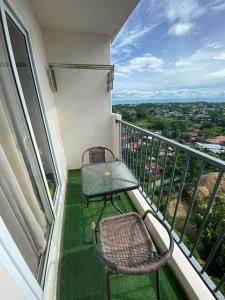 a balcony with a table and chairs on a balcony at Studio Stay at Saekyung Condominium in Lapu Lapu City
