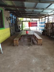 a picnic table sitting inside of a building at Cabañas Las Moras in Candelaria