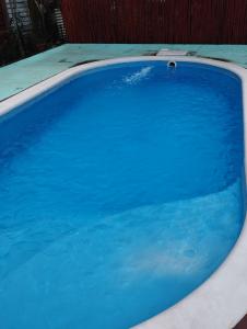 a large swimming pool with blue water at Cabañas Las Moras in Candelaria