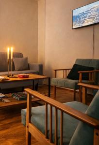 a living room with couches and a coffee table at The Corner House in Delčevo