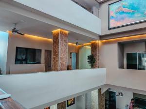 a living room with a staircase in a house at Panorama 1947 - Hotel Boutique Galería in El Banco