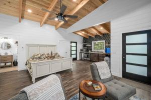 a bedroom with a bed and a ceiling fan at NEW - Treehouse - Dogwood in Jonesburg