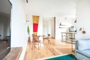 a living room with a couch and a table at The Windrose in Savannah +21 photos