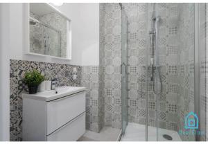 a bathroom with a shower and a sink at Sunlight Room - 15 min to Old Town Gdansk in Gdańsk