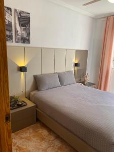 a bedroom with a bed with two pillows on it at Angeleyes in San Pedro del Pinatar