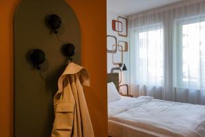 a hotel room with a bed and a window at HUB Apartments St Georg in Hamburg