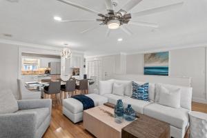 a living room with a couch and a table at Harbor On Holiday Isle in Destin