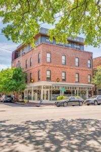 a large brick building with cars parked in front of it at The Windrose in Savannah