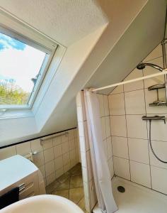 a bathroom with a toilet and a window at Gästezimmer Traisen in Traisen
