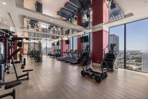 a gym with treadmills and exercise equipment in a building at Luxury Studio Steps from Bayfrontpark in Miami