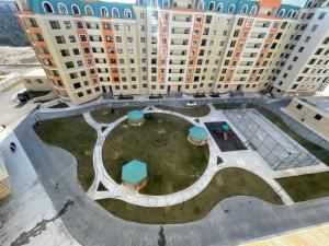 an aerial view of a large building with a courtyard at Caspian Mirvari in Sumqayıt