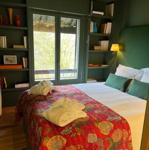 a bedroom with a bed with two towels on it at le Pullman in Deauville +38 photos