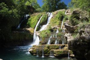 a waterfall in the middle of a river at Gite de Lise in Blandas