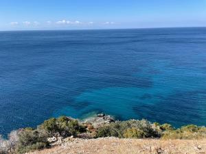 an aerial view of the blue water of the ocean at La casa di Grace in Seccheto