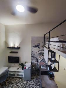 a dorm room with a bunk bed and a desk at Apartment Studio 6 in Mytilene
