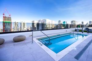 a swimming pool on the roof of a building at District 225 in Miami