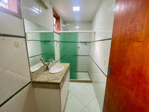 a bathroom with a sink and a mirror at Casa Centro do Rio in Rio de Janeiro