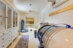 a room with a hospital bed in a room at Couple’s Retreat Near UVM! Unique Studio w/ Deck in Burlington