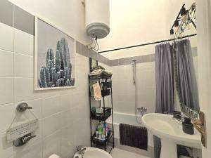 a bathroom with a toilet and a sink at La suite a pochi passi dal mare in Trapani