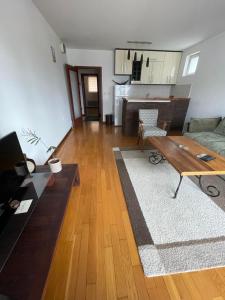 a living room with a couch and a table at Prvi maj in Ub