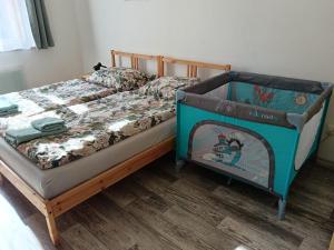a bedroom with a bed with a wooden frame at Apartmán BBB1 in Děčín