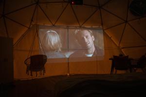 a large movie poster in a tent at Campfire Hollow in Eagle Rock +28 photos