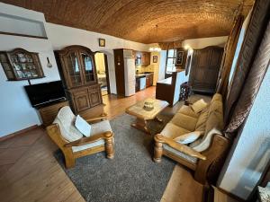 an overhead view of a living room with a couch and chairs at Apartmány v Buši in Buš