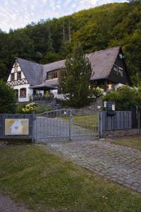 a fence in front of a house with a house at Landhaus Sonnenwinkel in Brodenbach