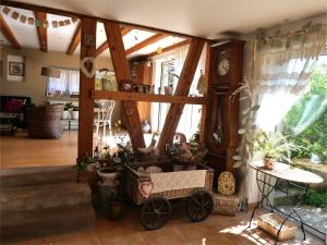 a living room with a clock on the wall at Hissele in Hilsenheim