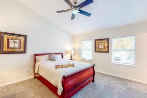 a bedroom with a bed and a ceiling fan at Indy Home w/ Dog-Friendly Yard! 9 Mi to Dtwn in Spring Hollow