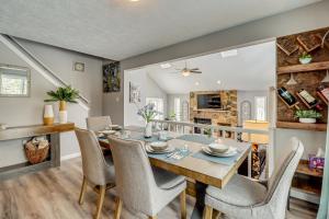 a dining room and living room with a table and chairs at Contemporary House in Lakeside Community! Poconos in Albrightsville
