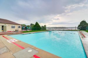 a large swimming pool with ducks in the water at Contemporary House in Lakeside Community! Poconos in Albrightsville