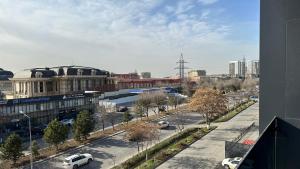 a view of a city with cars parked on a street at Alatau hotel in Shymkent