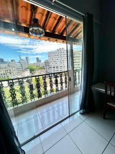 a large window with a view of a city at Casa Selarón - Lapa centro in Rio de Janeiro