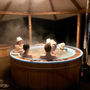 a group of people in a hot tub at Guta Weekend in Guta