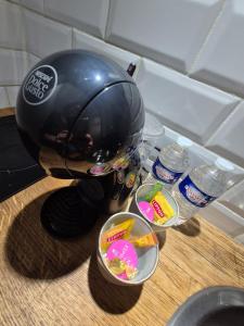 a coffee maker sitting on top of a counter with food at Studio - Le Cocon in Saint-Brieuc