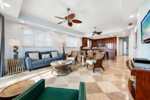 a living room with a couch and a table at A Somewhere is Here by Beachside Management in Siesta Key