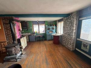 a kitchen with a woodburning stove in a room at Residence "Ana Pletvarska" in Prilep