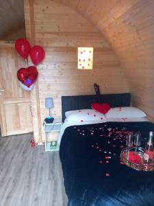 a bedroom with a bed with red hearts on it at Mountain View in Tipperary