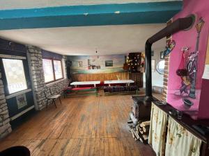 a living room with a wood stove in a room at Residence "Ana Pletvarska" in Prilep +23 photos