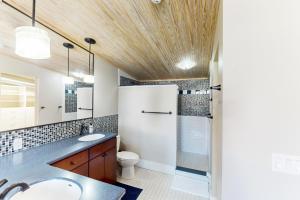 a bathroom with a sink and a toilet at 'Downtown Delight' w/ Patio! 1 Mi to Ball State in Muncie +27 photos