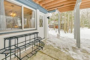 a screened in porch with a window and snow on the ground at 3 Mi to Windham Mountain: Pet-Friendly Apt w/ Yard in Hensonville +17 photos