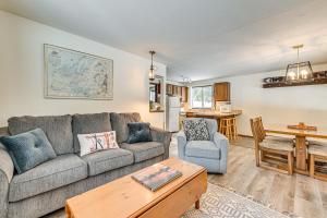 a living room with a couch and a table at 3 Mi to Windham Mountain: Pet-Friendly Apt w/ Yard in Hensonville