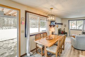 a kitchen and dining room with a table and chairs at 3 Mi to Windham Mountain: Pet-Friendly Apt w/ Yard in Hensonville