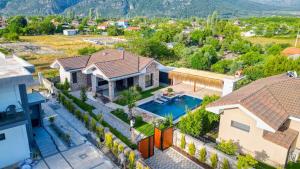 an aerial view of a house with a swimming pool at Citrus Stone House in Koycegiz