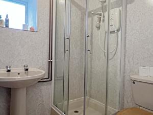 a bathroom with a shower and a sink at Brightworthy Farm Withypool in Withypool +19 photos