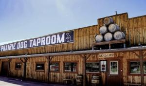 a store with a sign that reads prime dog trapatown at Firehouse Campground in Hill City +3 photos
